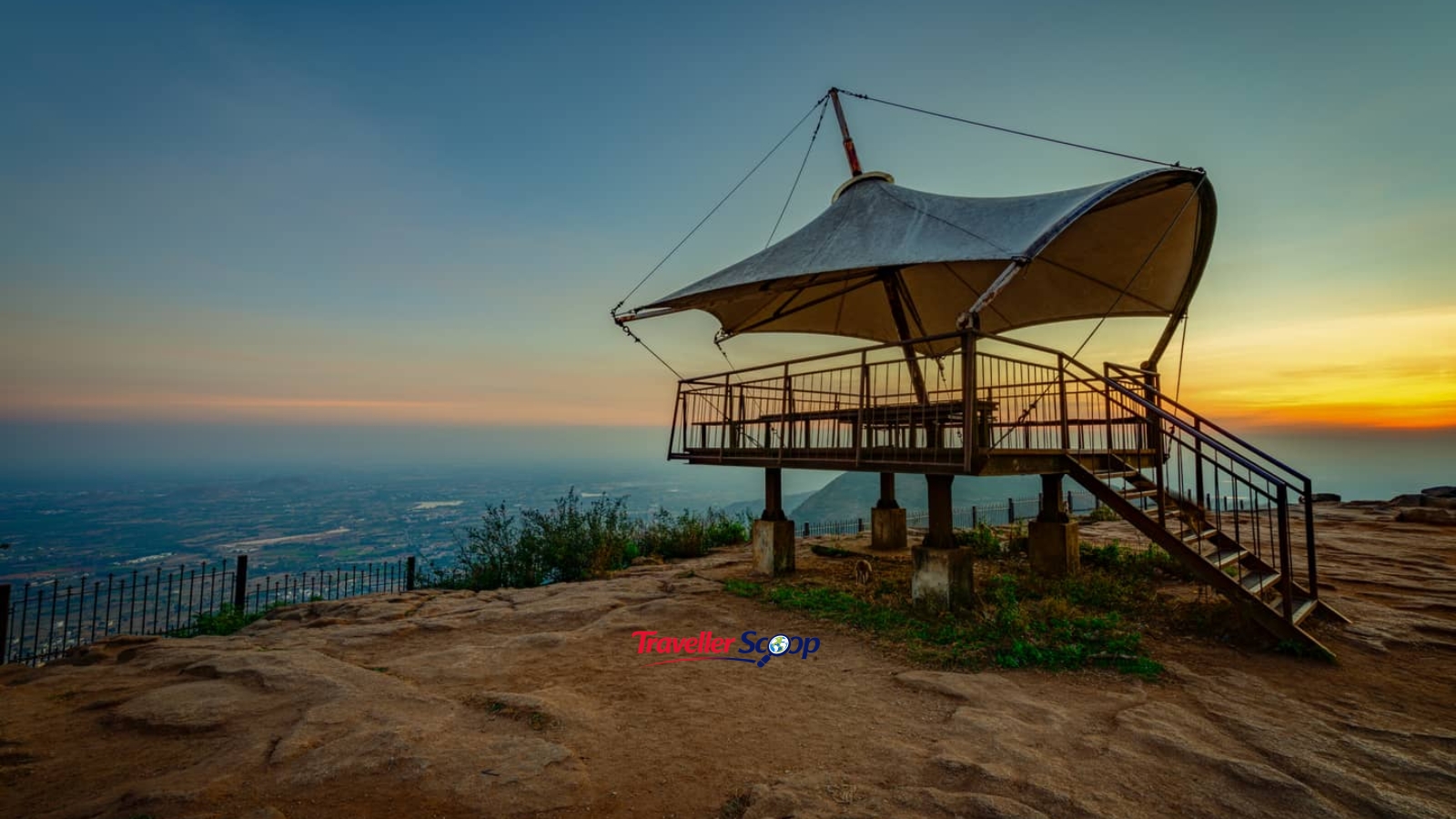 A cozy wooden porch overlooking Nandi Hills with misty morning views A cozy wooden porch overlooking Nandi Hills with misty morning views