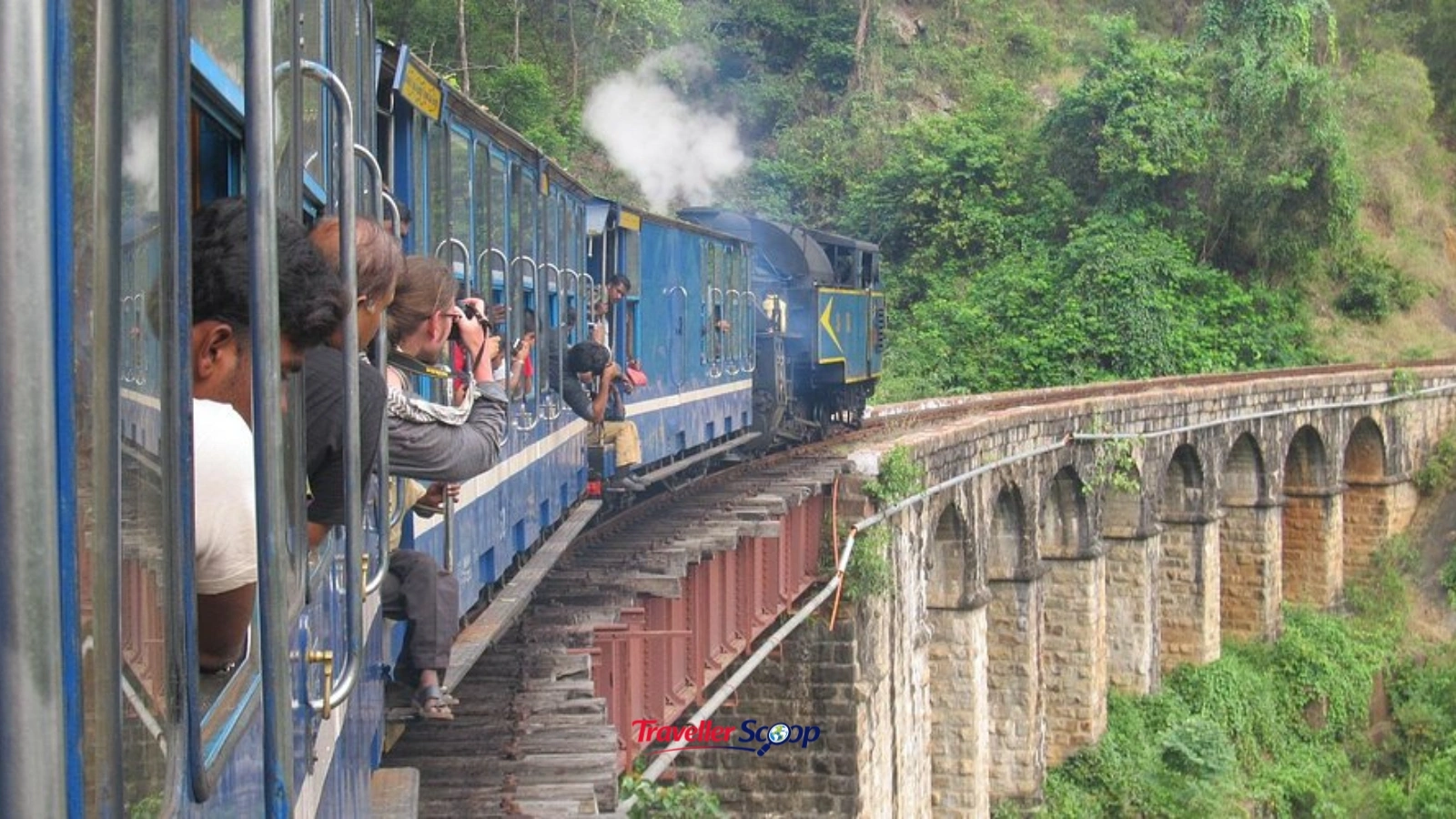 Family enjoying a ride on the Nilgiri Mountain Railway toy train in Ooty hill station” Family enjoying a ride on the Nilgiri Mountain Railway toy train in Ooty hill station"