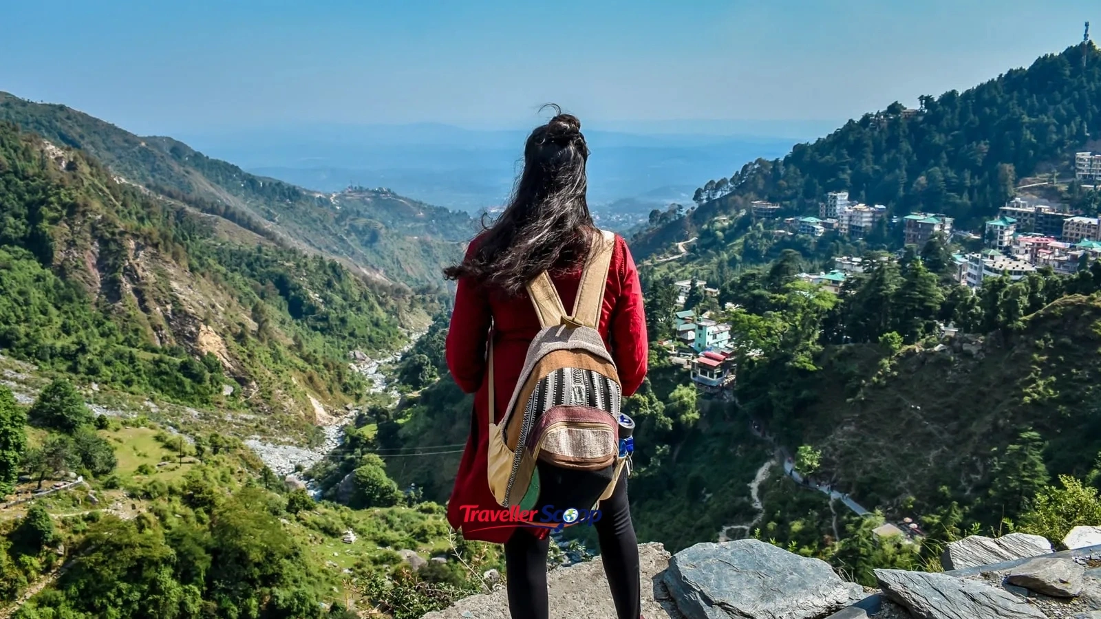 Solo female traveller safely exploring an Indian heritage destination with a backpack