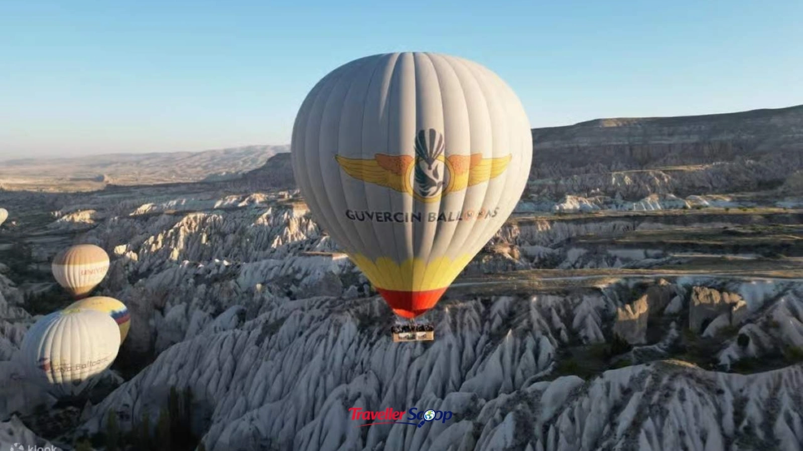 Hot air balloons over Cappadocia fairy chimneys at sunrise Hot air balloons over Cappadocia fairy chimneys at sunrise