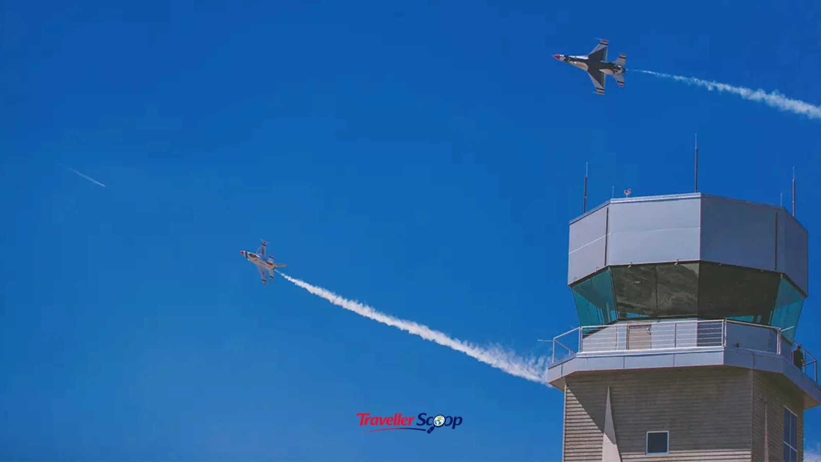 Airport control tower with multiple aircraft on the tarmac