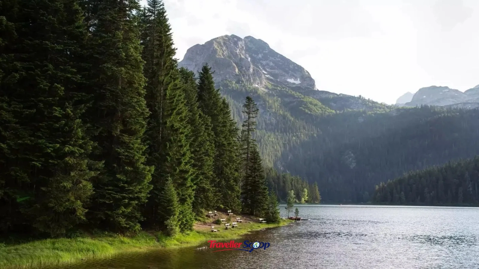Alpine lake in the Pirin Mountains surrounded by pine forest and rocky summits. Alpine lake in the Pirin Mountains surrounded by pine forest and rocky summits.