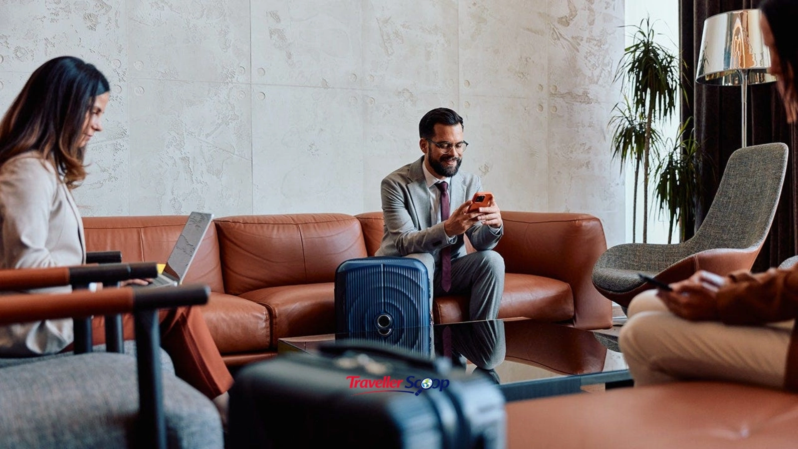 Person using laptop in an airport lounge near a “Free Wi-Fi” sign Person using laptop in an airport lounge near a "Free Wi-Fi" sign