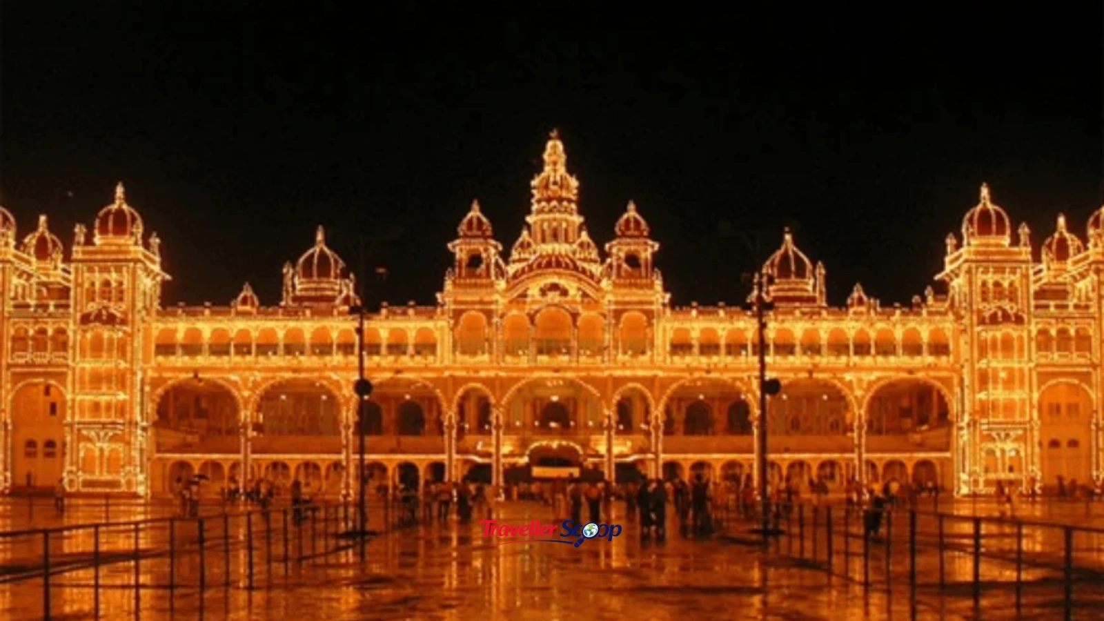 Mysore Palace lit up at night, popular Vande Bharat Bangalore to Mysore destination