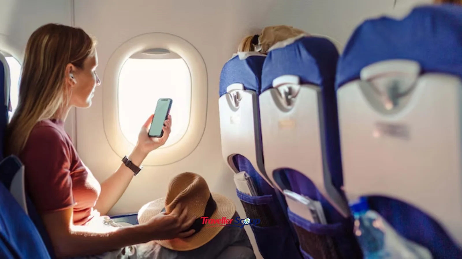 Air India A350 cabin with a passenger connecting to Air India Wi-Fi Air India A350 cabin with a passenger connecting to Air India Wi-Fi